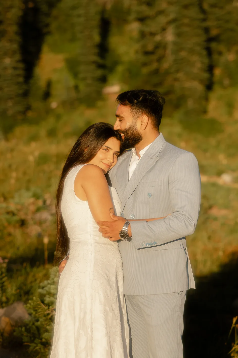 Tonakshi leaning into Vaibhav as he kisses her forehead